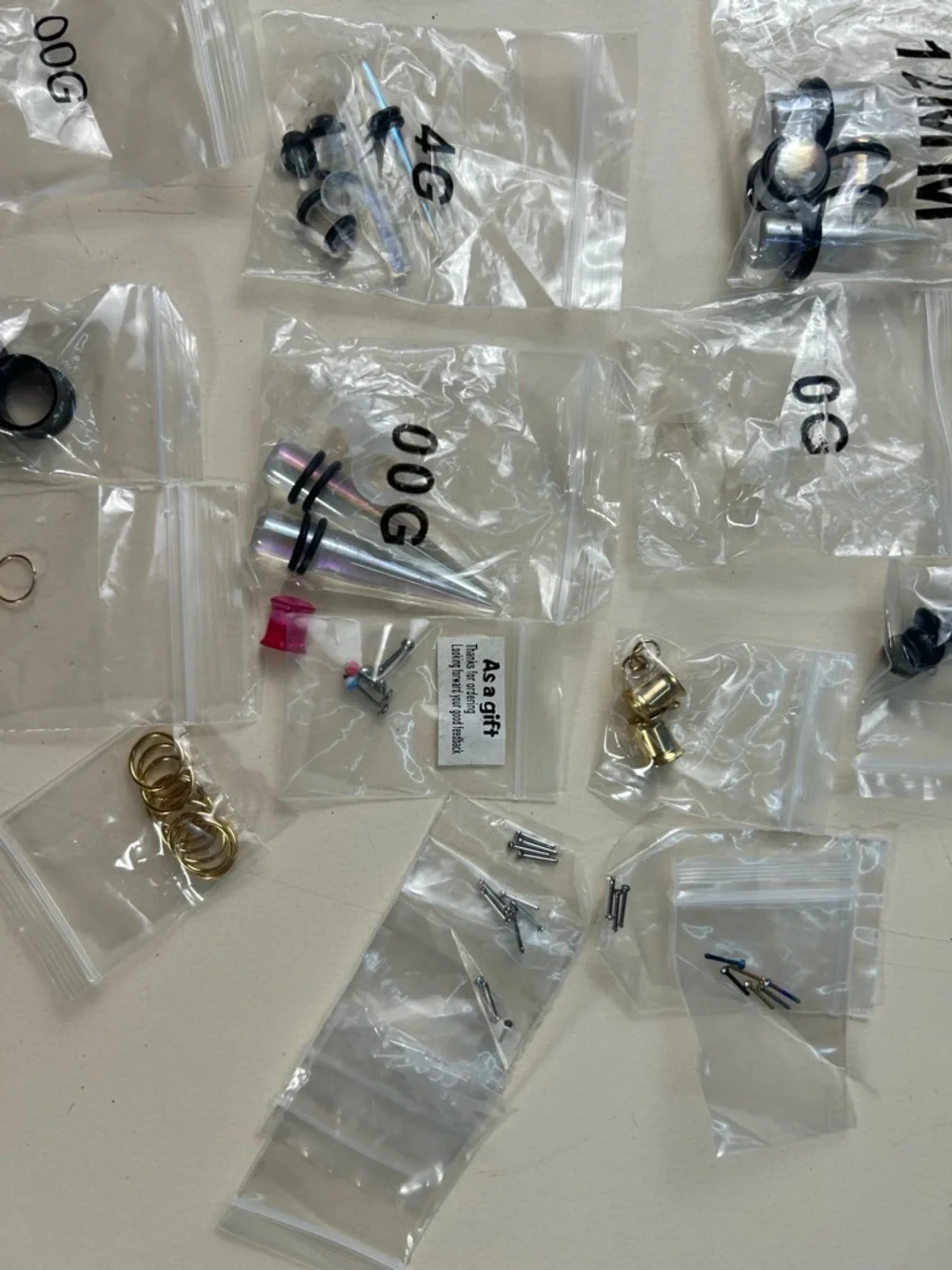 Jewelry: Earrings in various designs and sizes, and piercings.